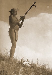 Prayer to the Mystery: Edward Curtis 1907 [Public Domain Image] Oglala Sioux man, Picket Pin, wearing breechcloth, holding pipe with mouthpiece pointing skyward, buffalo skull at his feet.